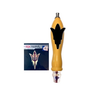 May include: A yellow and silver beer tap handle with a black trident logo. The logo says "TEAM EMBLEM ALUMINUM COLOR".