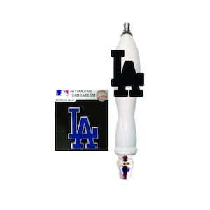 May include: White ceramic beer tap handle with a black LA logo. A blue and silver LA logo sticker is included.
