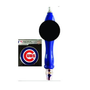 May include: Blue and red Chicago Cubs team emblem aluminum beer tap handle with a black cap. The handle is made of wood and has a silver metal base. The emblem is a circle with the word "CUBS" in red letters on a white background. The circle is surrounded by a blue ring.