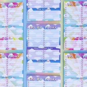 May include: A set of six rainbow-colored to-do list notepads with a cloud and sky design. Each notepad has the text "To Do Today" at the top and includes sections for "Really Should Do", "Can Put Off", and a blank section for writing tasks.