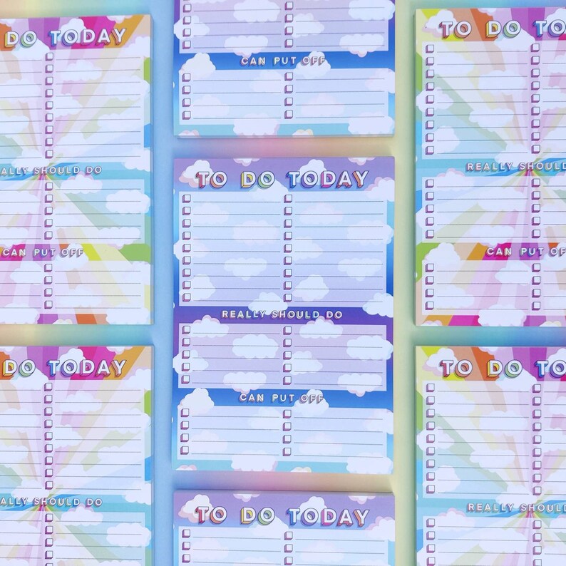May include: A set of six rainbow-colored to-do list notepads with a cloud and sky design. Each notepad has the text "To Do Today" at the top and includes sections for "Really Should Do", "Can Put Off", and a blank section for writing tasks.