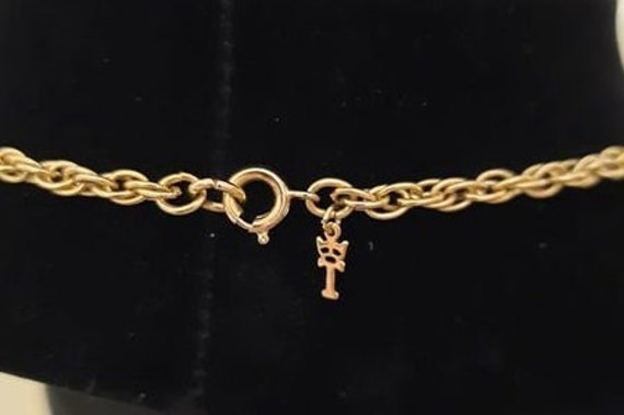 1970s Designer Trifari Gold Tone Filigree and Black Glass