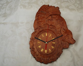 A Carved Wood Clock Featuring an American Indian, A Wolf and an Eagle
