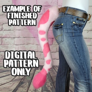 May include: A pink and white spotted tail attached to a person's jeans. The tail is a vibrant pink with large, circular white spots. The text "EXAMPLE OF FINISHED PATTERN" and "DIGITAL PATTERN ONLY" is visible.