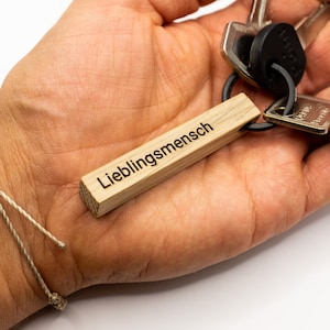 Wooden keychain with individual engraving personalized as a gift