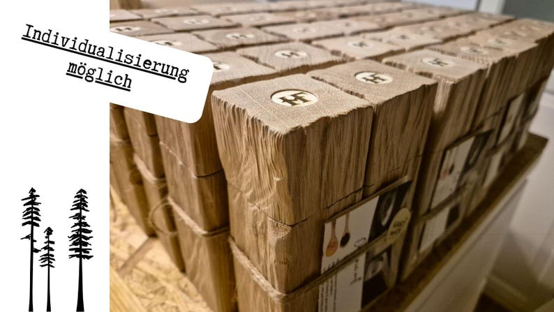 May include: A collection of wooden blocks, each with a carved letter and wrapped in paper. The blocks are arranged in rows, with the text "Individualisierung m&ouml;glich" in a white box. Silhouettes of trees are in the corner.