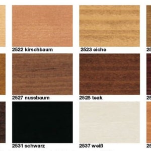 May include: A color chart featuring wood stain samples. The chart displays twelve different wood stain colors, including light beige, medium brown, dark brown, and black. Each sample is labeled with a number and a name.