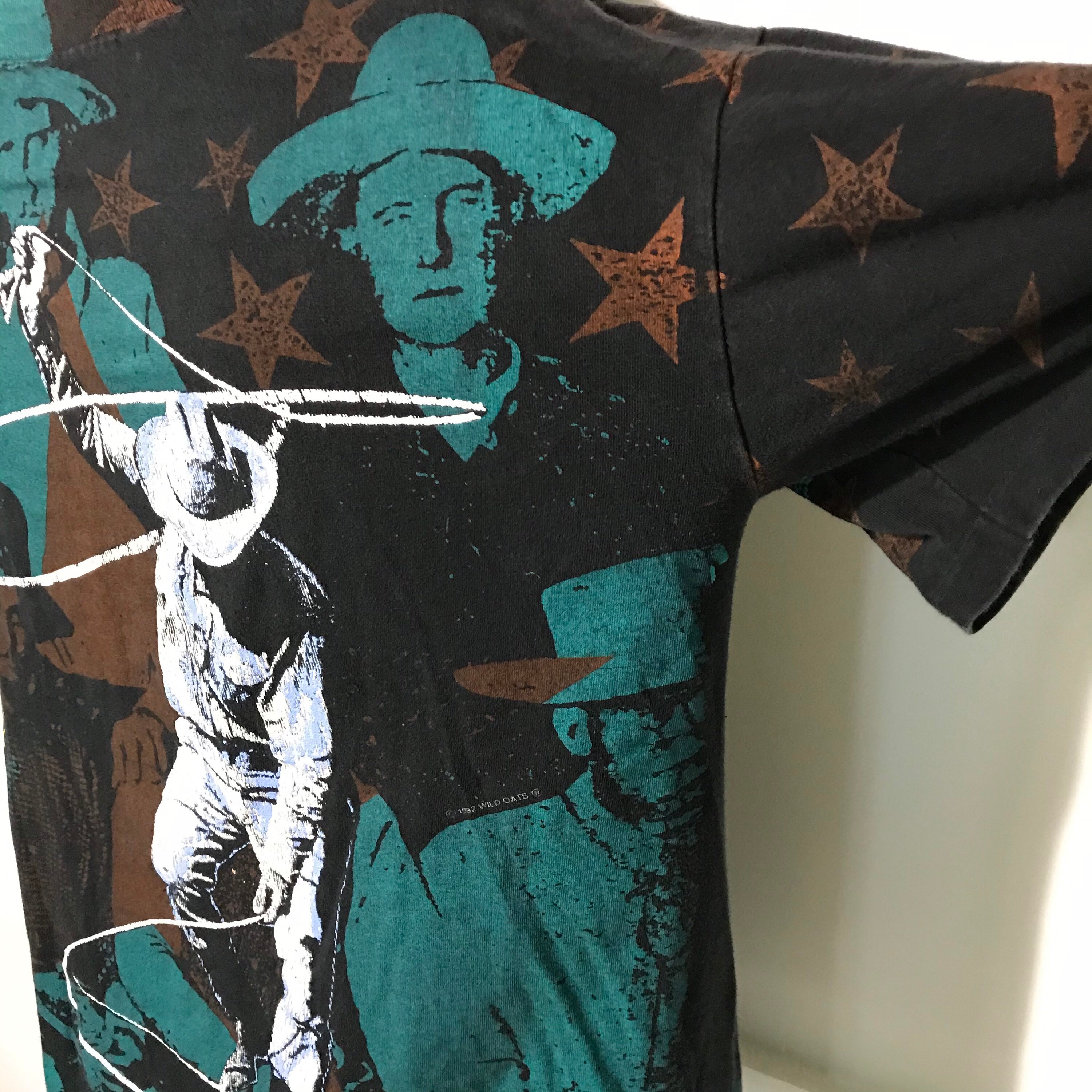 Vintage 1992 All Over Print Big West Cowboy Tee by Wild Oats Vintage 1992 All Over Print Big West Cowboy Tee by Wild Oats