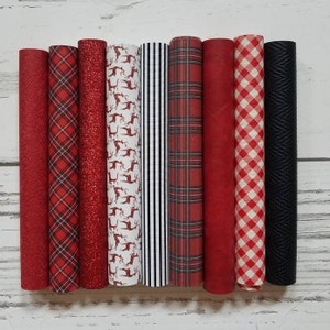 May include: Eight different patterned fabric sheets in red, black, and white. The patterns include plaid, gingham, glitter, and reindeer.