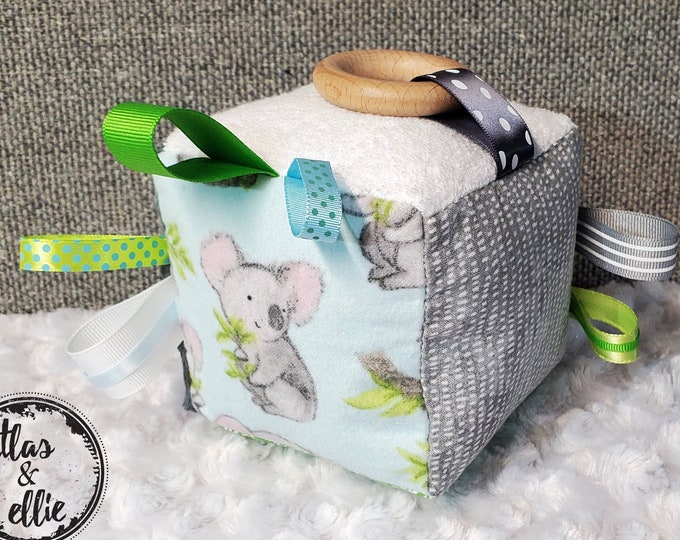 Koala Sensory Activity Toy for Babies, Each side has textures and prints to enhance your baby's senses! A great toy for tummy time and more