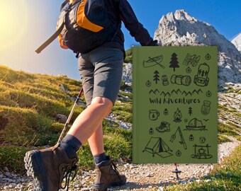May include: A person hiking on a mountain trail, carrying a backpack and using a walking stick. A green journal with the words "Wild Adventures" and outdoor-themed illustrations is visible. The hiker wears brown hiking boots.