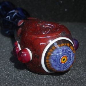 Red and blue ostrich eye handmade borosilicate glass pipe.Dr Sawfish 2023.