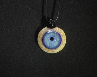 Blue eye handmade borosilicate glass pendant.Dr Sawfish 2023