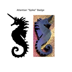 May include: A black seahorse badge with a unicorn horn, labeled "Atlantian 'Spike' Badge." The seahorse is depicted in both a silhouette and a 3D-printed version. The 3D version is dark gray and sits on a textured surface.