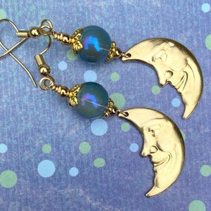 Brass Crescent Moon Earrings: Man in the Moon, Blue Glass Orbs