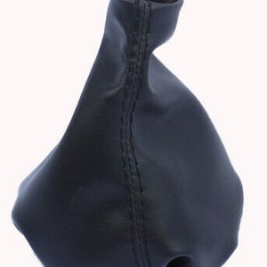 May include: Black leather gear shift boot with a stitched seam down the center.