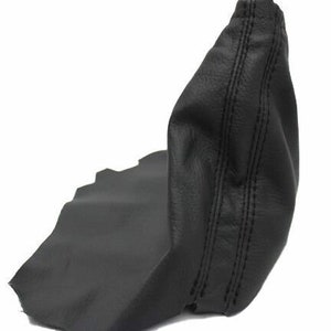 May include: Black leather gear shift boot with a stitched seam down the center.