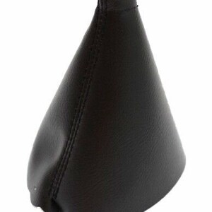 May include: Black leather gear shift boot cover. The cover is cone-shaped with a stitched seam down the front.