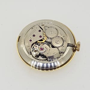 Dugena 14kt gold case, Swiss made image 6