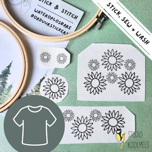 May include: A set of iron-on patches featuring black and white sunflower designs. The patches are on a white fabric background. The text "Stick, Sew + Wash" is in a green box. The text "Wateroplosbare BorduurStickers" is on a white card. The text "Stick & Stitch" is on the card.