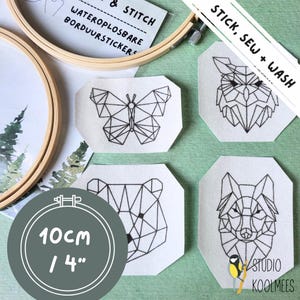 May include: Four iron-on patches featuring geometric animal designs: a butterfly, a bear, a wolf, and an owl. The patches are white with black outlines and are 4 inches in diameter. The text "STICK, SEW + WASH" is visible in the top right corner of the image.