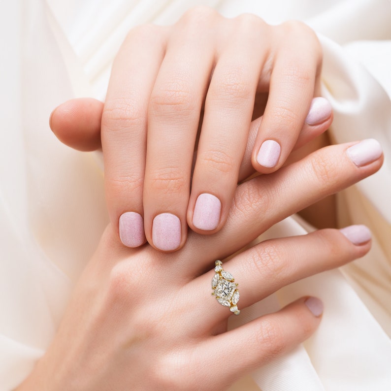 a woman's hand with a ring on it