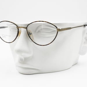 OTTIS DESIGN, Italian 1990s eyeglass frame Golden aged & brown military pattern, semi-ovaloid rims, New Old Stock image 1