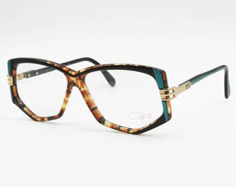 Cazal mod. 322 vintage eyewear frame multicolour acetate, unique and hype glasses, New Old Stock 80s