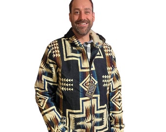 May include: A black, brown, and beige patterned hooded jacket with a zipper closure. The jacket has a geometric design with a cross pattern.