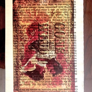 May include: A vintage book with a red and gold design on the cover. The book is open to a page with text and a faded image of a woman in a red dress. The text on the page reads "147".