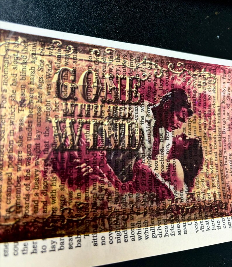 May include: A vintage-style collage featuring a couple embracing, with the words "Gone With The Wind" superimposed over them. The background is a mix of brown, red, and gold tones, with text from a book visible.