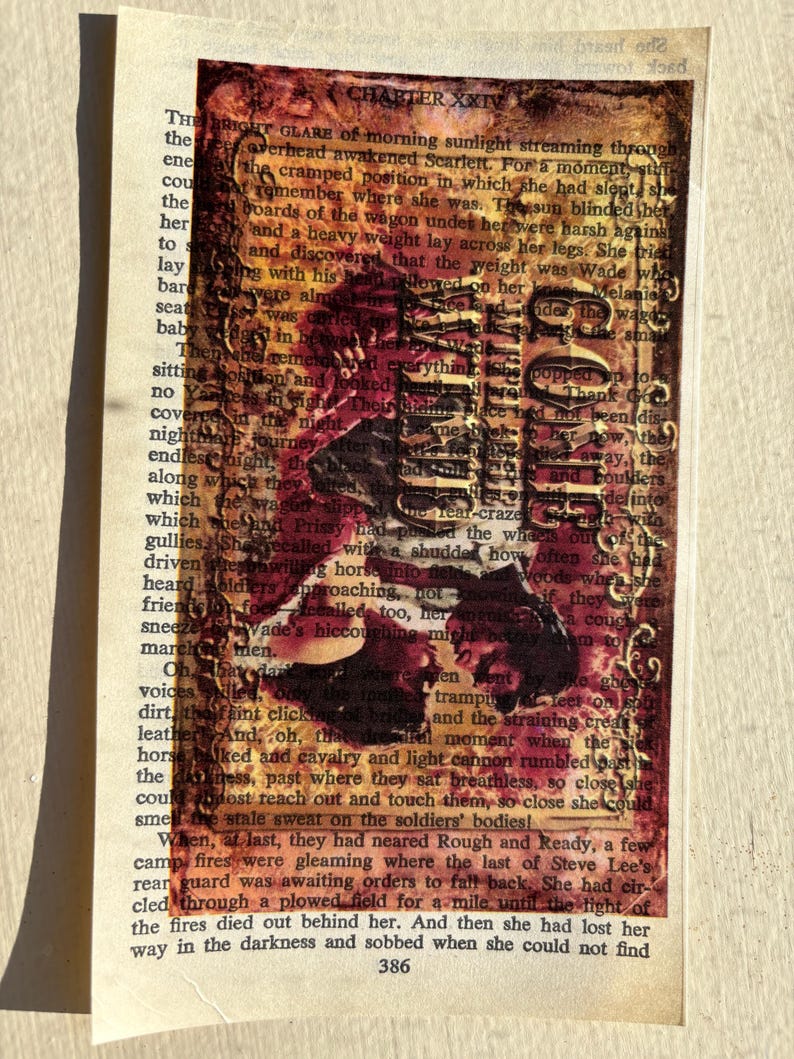 May include: A vintage book with a red, orange, and yellow stained cover. The book is open to a page with text about a journey and a soldier. The text is partially obscured by a red and black image of a soldier.