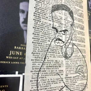 May include: A black and white illustration of a man's face with a mustache and a beard. The illustration is superimposed on a page from a dictionary, with the word "Australia" highlighted.