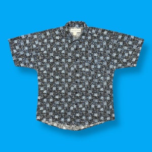 May include: A black and white checkered short-sleeved button-up shirt with a white tag that says "Windsor 212".