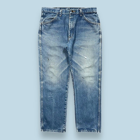 デニム・ジーパン   90s loose fit dark blue destroyed denim Eco Ezra Destroyed Skinny Jeans | GUESS Factory