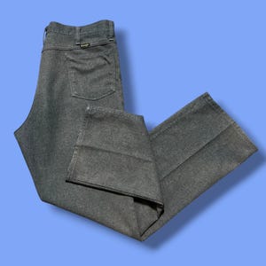 Pantalones Wrangler de poliéster vintage, desteñidos por el sol, desgastados, hechos en EE. UU., años 80 y 90, talla 36x31.