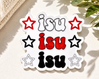 May include: A white die-cut sticker featuring the text "isu" repeated three times in a stacked layout. The top text is white with a black outline, the middle is red, and the bottom is black. Each row is flanked by a star outline in red, black, and white.