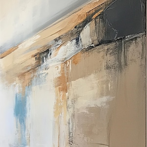 May include: Abstract painting with a textured surface. The artwork features a palette of neutral colors, including beige, gray, and white, with accents of blue and brown. The brushstrokes create a sense of depth and movement, evoking a landscape.