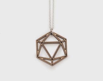 May include: A wooden geometric pendant necklace with a silver chain. The pendant is shaped like a hexagon with a triangular design inside.
