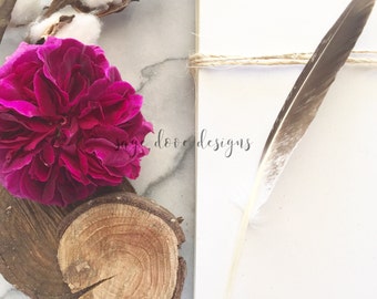 Download Free Marble Styled Stock Flatlay Photography With Magenta Rose, Feather and Eucalyptus PSD Template