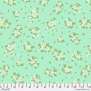 May include: A mint green fabric with a white floral pattern. The fabric features small white flowers with green leaves arranged in clusters.