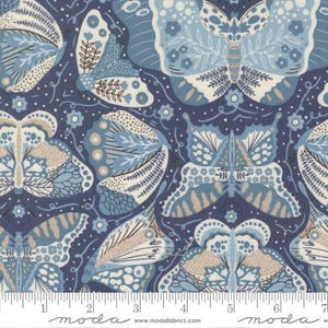 May include: A fabric with a repeating pattern of stylized butterflies in shades of blue, beige, and white on a navy blue background. The butterflies have intricate wing designs and are interspersed with small floral elements. The fabric is measured in inches.