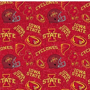 May include: Red fabric with a repeating pattern of Iowa State Cyclones logos, helmets, and text. The design includes the words "IOWA STATE" and "CYCLONES" in white and gold, along with the team's cardinal mascot. The fabric is 100% cotton.