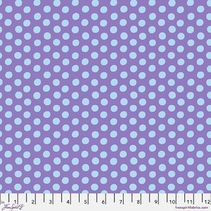 May include: A fabric with a repeating pattern of light blue polka dots on a purple background. The dots are evenly spaced and create a visually appealing design. The fabric is measured in inches.