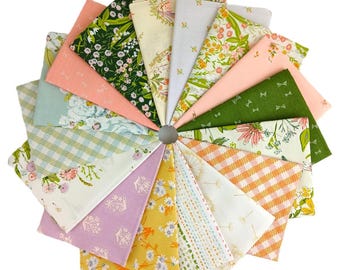 May include: A circular arrangement of fabric squares in various floral and geometric patterns. The color palette includes greens, pinks, yellows, and blues. The fabrics are arranged around a central gray ring, creating a fan-like display.