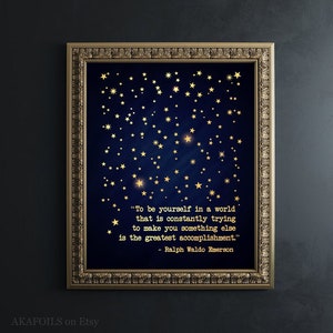 May include: A navy blue printable art print with gold foil stars and a quote by Ralph Waldo Emerson: "To be yourself in a world that is constantly trying to make you something else is the greatest accomplishment."