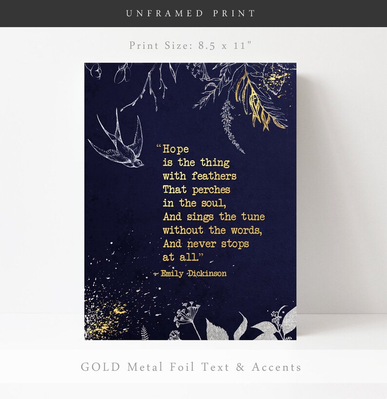 May include: A navy blue print with gold foil text and accents. The print features a quote by Emily Dickinson: "Hope is the thing with feathers That perches in the soul, And sings the tune without the words, And never stops at all."