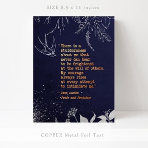 May include: A navy blue print with a silver floral design and a quote from Jane Austen's Pride and Prejudice in copper foil lettering. The quote reads: "There is a stubbornness about me that never can bear to be frightened at the will of others. My courage always rises at every attempt to intimidate me."