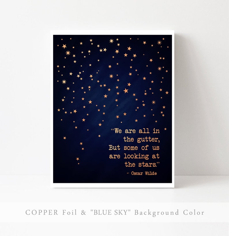 May include: A navy blue background with gold stars and a quote by Oscar Wilde: "We are all in the gutter, But some of us are looking at the stars." The text is in a typewriter font.