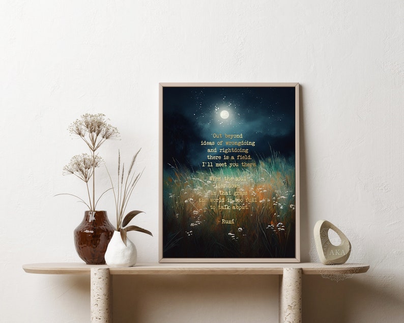 May include: A framed print with a dark blue background and a moon in the sky. The print features a quote in gold lettering that reads: "Out beyond ideas of wrongdoing and rightdoing there is a field. I'll meet you there. When the soul lies down in that grass the world is too full to talk about." -Rumi